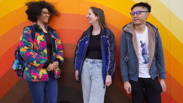 Students stood against street art