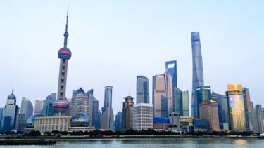 A skyline with large skyscrapers on a waterfront.