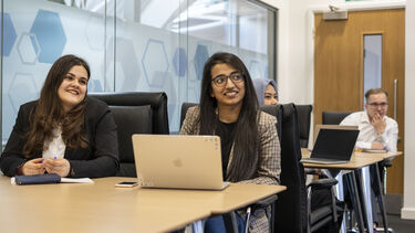 Students engaging in an MBA seminar.
