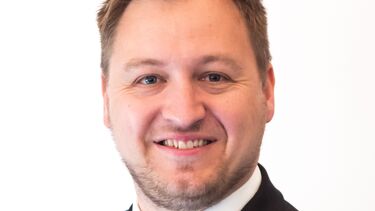 Jonny Wathen wearing a suit.