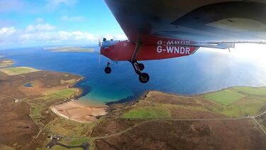 The view from underneath the wing of an ULTRA UAV during a test flight