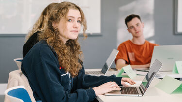 Students in seminar with laptops