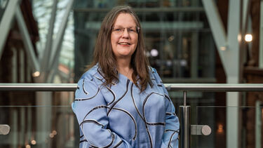 Professor Joan Cordiner smiling as she stands in the Engineering Heartspace