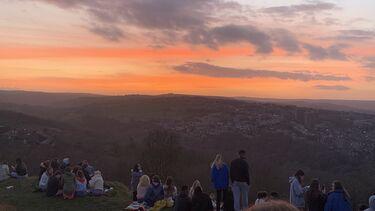 A photo of the sunsetting over Sheffield at Bole Hills