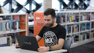 Student studying with laptop in the Diamond libary
