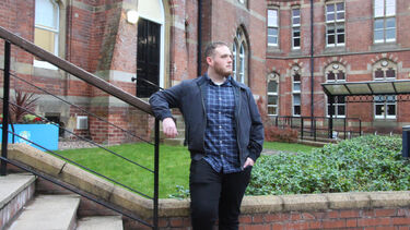 Harry Imlack standing outside the front of Bartolome House