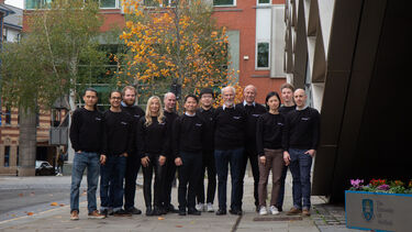 The core team stood together outside of the University of Sheffield's Diamond building