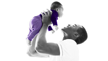 father holding baby