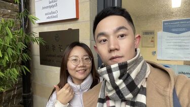 Teachers Li Junchi and Du Jiaxing outside the SCI