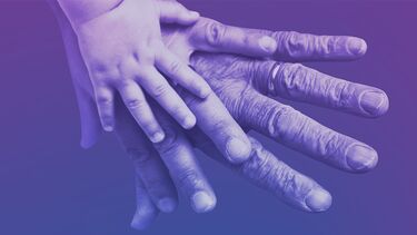 three hands from people in three generations on top of each other.