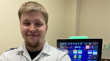 Critical care nurse stood in front of machines