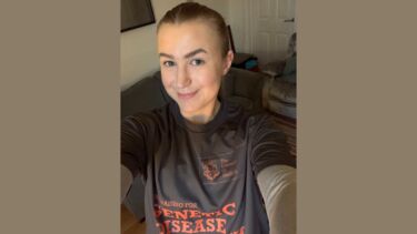 Lauren in her 'Fundraising for Genetic Disease Research' running gear