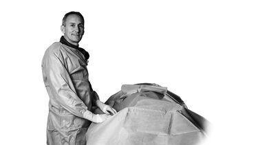 Rob Storey standing over patient