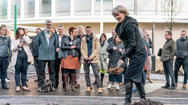 FOSS The Wave Time Capsule - professor gill valentine throwing dirt on steel capsule