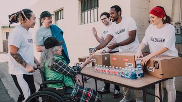 A team serving food and drink to vulnerable people.