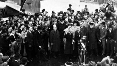 Neville Chamberlain waving his Munich agreement at the airport on his return to England, 1938.