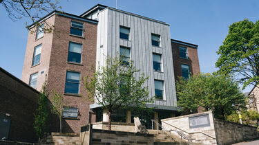 A view of the Management School building from Conduit Road