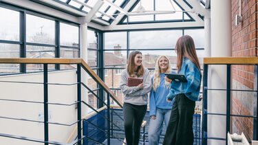 Students on Bartolome House stairs