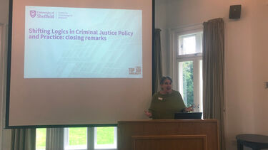 Joanna is providing a keynote speech at the end of the CCR international conference. In front of a power point saying closing remarks