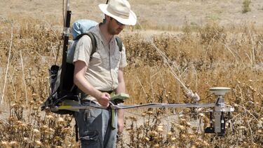 One of the researchers filming the ants foraging for food