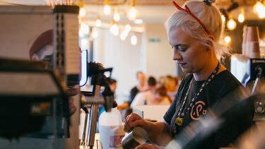 A woman working in Coffee Revolution