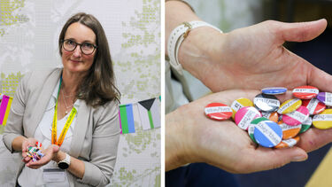 Heidi Christensen holding pronoun badges