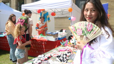Teacher Lina by the shop stall