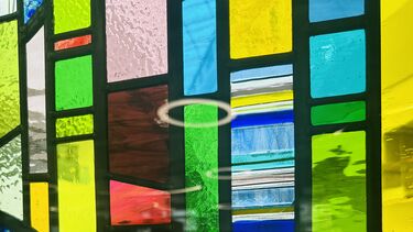 Close-up of the stained window at the wave building cafe