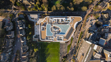 A shot of the Wave building from above, including sports pitch and surrounding roads
