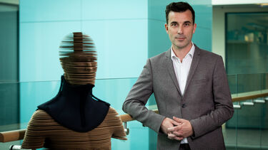 Professor McDermott standing next to the HeadUp Collar