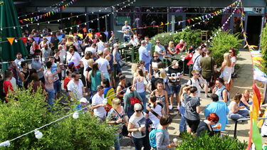 A large group of people celebrating pride month