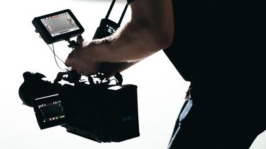 Person filming with a large camera