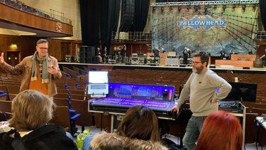 Group of students on trip to sheffield city hall looking at stage