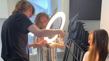 Students working with lighting equipment