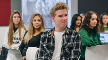 Students listening in a seminar.
