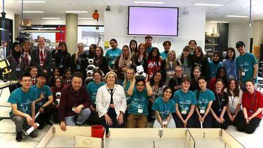 Photograph of ambassadors, staff members, attendees and a few MiRo robots at Girls into Electronics 2023