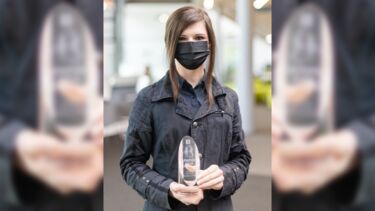 An image of Sylvia Whittle holding the Papin Prize 