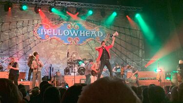 Man performing on stage with megaphone 