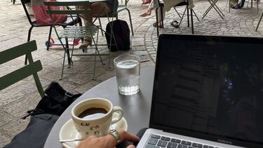 Image of Owen Havercroft studying in a cafe