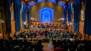 Musicians playing in big concert hall
