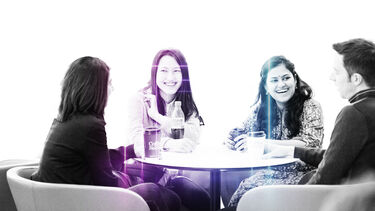 students sitting around table