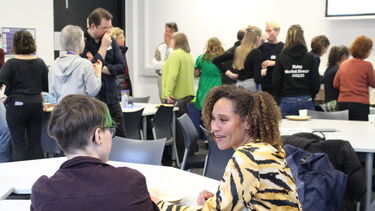 conference setting with 2 people talking 