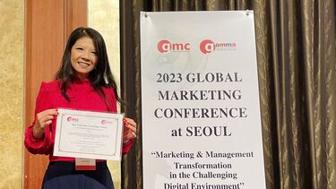 Sabrina Thornton receiving her Best Paper award.