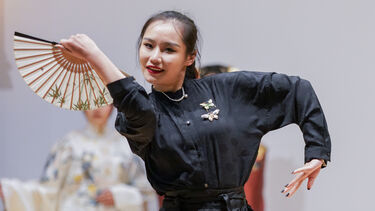 Model displays Hanfu clothing on stage
