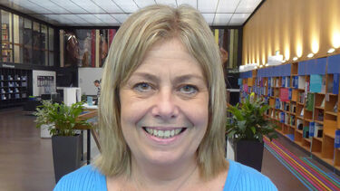 Alison Little stands in Western Bank Library