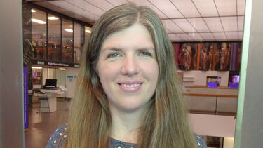 Angela Haighton stands in Western Bank Library