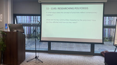 Image of lecturn and powerpoint presentation