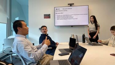 Academics sat around a table.