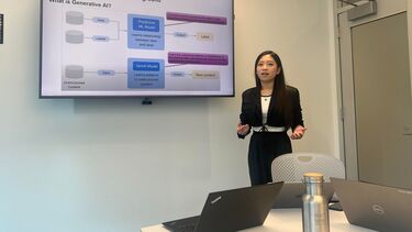 A PhD student presenting their research.