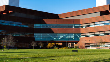 A building at Penn State University with a green space around it